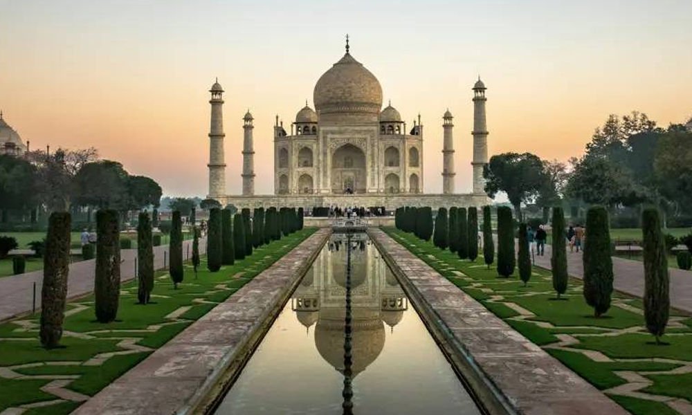Taj Mahal sunrise view - iconic marble monument of eternal love in Agra Uttar Pradesh tour package